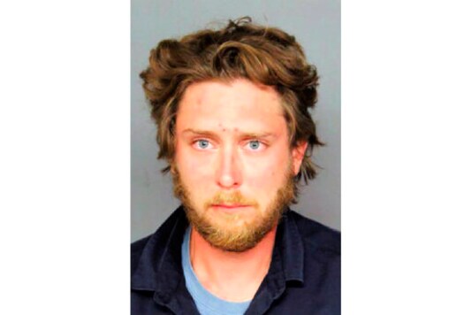 This photo provided by the Denver Police Department shows Matthew Dolloff. Police identified on Sunday, Oct. 11, 2020, a 30-year-old man as the suspect in a fatal shooting that took place in downtown Denver during dueling protests. Matthew Dolloff, a private security guard working for local television station KUSA TV, was being held for investigation of first degree murder in connection with Saturday afternoon's shooting, Denver police said in a social media post. (Denver Police Department via AP) This photo provided by the Denver Police Department shows Matthew Dolloff. Police identified on Sunday, Oct. 11, 2020, a 30-year-old man as the suspect in a fatal shooting that took place in downtown Denver during dueling protests. Matthew Dolloff, a private security guard working for local television station KUSA TV, was being held for investigation of first degree murder in connection with Saturday afternoon's shooting, Denver police said in a social media post. (Denver Police Department via AP)