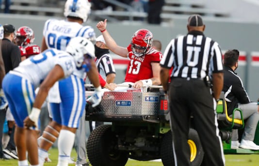 North Carolina State quarterback Devin Leary (13) gives a thumbs-up as he is taken off the field after being injured during the second half of an NCAA college football game against Duke in Raleigh, N.C., Saturday, Oct. 17, 2020. (Ethan Hyman/The News & Observer via AP) North Carolina State quarterback Devin Leary (13) gives a thumbs-up as he is taken off the field after being injured during the second half of an NCAA college football game against Duke in Raleigh, N.C., Saturday, Oct. 17, 2020. (Ethan Hyman/The News & Observer via AP)