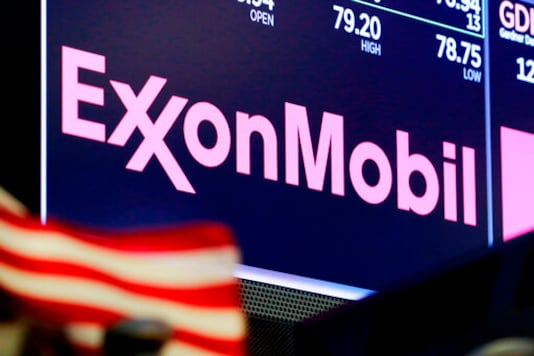 FILE - In this April 23, 2018, file photo, the logo for ExxonMobil appears above a trading post on the floor of the New York Stock Exchange. Exxon lost $1.1 billion in the second quarter, Friday, July 31, 2020, its economic pain deepening as the pandemic kept households on lockdown, diminishing the need for oil around the world. (AP Photo/Richard Drew, File) FILE - In this April 23, 2018, file photo, the logo for ExxonMobil appears above a trading post on the floor of the New York Stock Exchange. Exxon lost $1.1 billion in the second quarter, Friday, July 31, 2020, its economic pain deepening as the pandemic kept households on lockdown, diminishing the need for oil around the world. (AP Photo/Richard Drew, File)