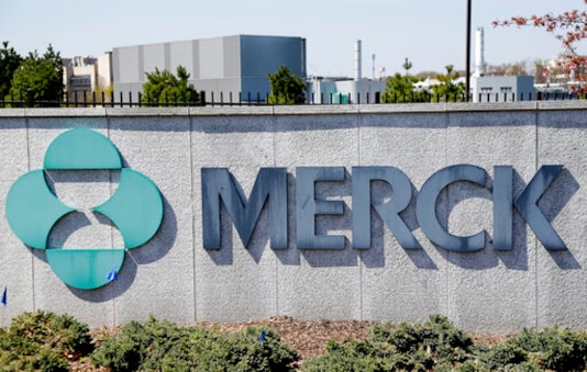 FILE- This May 1, 2018, file photo shows Merck corporate headquarters in Kenilworth, N.J.  Surging sales of cancer medicines and reduced spending helped Merck overcome a big hit from the coronavirus pandemic and increase its profit 12% in the second quarter. The  drugmaker on Friday, July 31, 2020,  increased its financial forecast for the year, all while its investing in development of two experimental vaccines and a possible treatment for COVID-19.  (AP Photo/Seth Wenig, File)