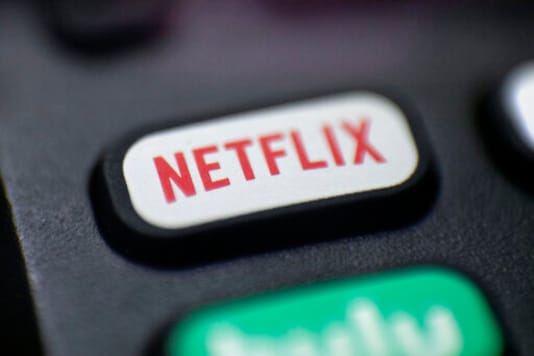 FILE - This Aug. 13, 2020 photo shows a logo for Netflix on a remote control in Portland, Ore. Netflix Inc. (NFLX) on Tuesday, Oct. 20, 2020 reported third-quarter net income of $790 million. The Los Gatos, California-based company said it had profit of $1.74 per share. (AP Photo/Jenny Kane, File) FILE - This Aug. 13, 2020 photo shows a logo for Netflix on a remote control in Portland, Ore. Netflix Inc. (NFLX) on Tuesday, Oct. 20, 2020 reported third-quarter net income of $790 million. The Los Gatos, California-based company said it had profit of $1.74 per share. (AP Photo/Jenny Kane, File)