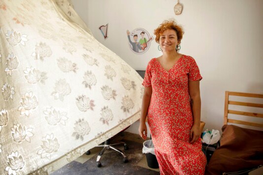 Basma Mostafa, a journalist for al-Manassa news website poses for a photo at a friend's apartment, in Cairo, Egypt, July 11, 2020. Egyptian authorities detained Mostafa after she traveled to the southern city of Luxor on Saturday, Oct. 3, 2020, to cover the alleged killing of a man during a police raid last week, her employer and family said Sunday. Rights lawyer Karim Abdel-Rady, who is also her husband, said his wife, the 30-year-old mother of two, appeared Sunday at the headquarters of Egypt's state security prosecution in the capital, Cairo. (AP Photo/Nariman El-Mofty) Basma Mostafa, a journalist for al-Manassa news website poses for a photo at a friend's apartment, in Cairo, Egypt, July 11, 2020. Egyptian authorities detained Mostafa after she traveled to the southern city of Luxor on Saturday, Oct. 3, 2020, to cover the alleged killing of a man during a police raid last week, her employer and family said Sunday. Rights lawyer Karim Abdel-Rady, who is also her husband, said his wife, the 30-year-old mother of two, appeared Sunday at the headquarters of Egypt's state security prosecution in the capital, Cairo. (AP Photo/Nariman El-Mofty)