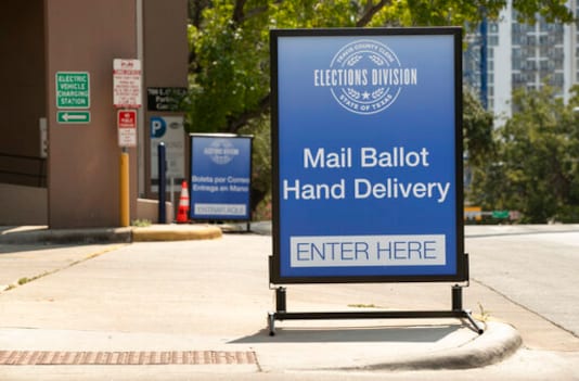 A sign indicates a drive-through ballot drop off location at the 700 Lavaca Parking Garage in Austin, Texas, on Thursday Oct. 1, 2020, shortly after an order was announced by Gov. Greg Abbott restricting such drop off locations. The number of locations where Texas voters can drop off their mail-in ballots has been vastly reduced to ensure poll security, Gov. Greg Abbott said Thursday. (Jay Janner)/Austin American-Statesman via AP) A sign indicates a drive-through ballot drop off location at the 700 Lavaca Parking Garage in Austin, Texas, on Thursday Oct. 1, 2020, shortly after an order was announced by Gov. Greg Abbott restricting such drop off locations. The number of locations where Texas voters can drop off their mail-in ballots has been vastly reduced to ensure poll security, Gov. Greg Abbott said Thursday. (Jay Janner)/Austin American-Statesman via AP)