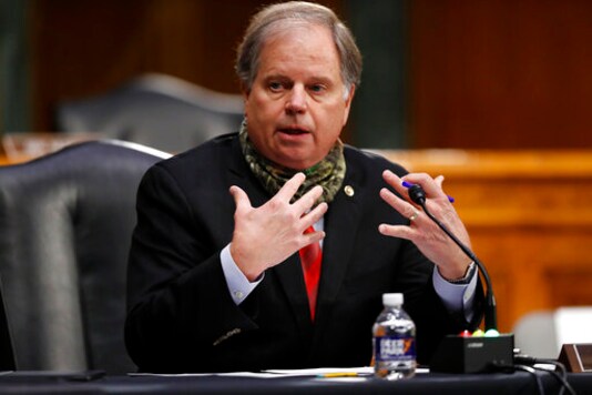 FILE - In this Thursday, May 7, 2020, file photo, U.S. Sen. Doug Jones, D-Ala., speaks during a Senate Health Education Labor and Pensions Committee hearing on new coronavirus tests on Capitol Hill in Washington. Democratic Sen. Doug Jones of Alabama has called Republican challenger Tommy Tuberville Coach Clueless for the former football coach's recent comments about the coronavirus. Jones attacked Tuberville in a campaign appearance Friday, Sept. 11, 2020.(AP Photo/Andrew Harnik, Pool, File) FILE - In this Thursday, May 7, 2020, file photo, U.S. Sen. Doug Jones, D-Ala., speaks during a Senate Health Education Labor and Pensions Committee hearing on new coronavirus tests on Capitol Hill in Washington. Democratic Sen. Doug Jones of Alabama has called Republican challenger Tommy Tuberville Coach Clueless for the former football coach's recent comments about the coronavirus. Jones attacked Tuberville in a campaign appearance Friday, Sept. 11, 2020.(AP Photo/Andrew Harnik, Pool, File)