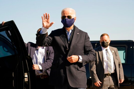 Democratic presidential candidate former Vice President Joe Biden arrives to board his campaign plane at the New Castle Airport in New Castle, Del., Sunday, Oct. 18, 2020, en route to Durham, N.C. (AP Photo/Carolyn Kaster) Democratic presidential candidate former Vice President Joe Biden arrives to board his campaign plane at the New Castle Airport in New Castle, Del., Sunday, Oct. 18, 2020, en route to Durham, N.C. (AP Photo/Carolyn Kaster)