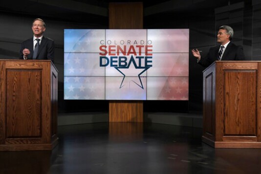 FILE - In this Oct. 9, 2020, file photo Republican U.S. Sen. Cory Gardner, right, and Democratic former Colorado Gov. John Hickenlooper participate in a debate in Denver. Gardner is poised to be one of the votes that places President Donald Trump's nominee Amy Coney Barrett on the Supreme Court just before the election. (Hyoung Chang/The Denver Post via AP, Pool, File) FILE - In this Oct. 9, 2020, file photo Republican U.S. Sen. Cory Gardner, right, and Democratic former Colorado Gov. John Hickenlooper participate in a debate in Denver. Gardner is poised to be one of the votes that places President Donald Trump's nominee Amy Coney Barrett on the Supreme Court just before the election. (Hyoung Chang/The Denver Post via AP, Pool, File)