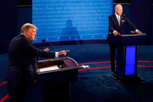 President Donald Trump makes a points as Democratic presidential candidate former Vice President Joe Biden listens during the first presidential debate Tuesday, Sept. 29, 2020, at Case Western University and Cleveland Clinic, in Cleveland, Ohio. (AP Photo/Morry Gash, Pool)