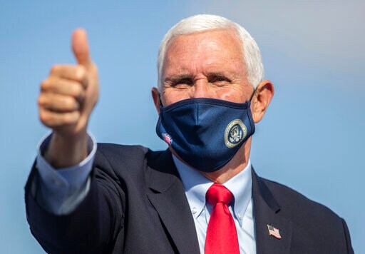 Vice President Mike Pence gives a thumbs up during the Make America Great Again Victory rally at the Piedmont Triad International Airport in Greensboro, N.C., on Tuesday, Oct. 27, 2020. (Khadejeh Nikouyeh/News & Record via AP)