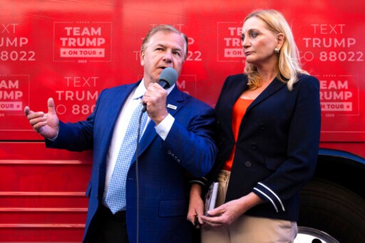 St. Louis-based lawyers Mark and Patricia McCloskey speak outside the Republican campaign office in downtown Scranton, Pa., during an appearance with former congressman Lou Barletta for a Trump campaign event on Wednesday, Sept. 30, 2020. The McCloskeys received national attention in June when they pulled guns on Black Lives Matter protesters who broke into their gated community and marched past their home. (Christopher Dolan/The Times-Tribune via AP) St. Louis-based lawyers Mark and Patricia McCloskey speak outside the Republican campaign office in downtown Scranton, Pa., during an appearance with former congressman Lou Barletta for a Trump campaign event on Wednesday, Sept. 30, 2020. The McCloskeys received national attention in June when they pulled guns on Black Lives Matter protesters who broke into their gated community and marched past their home. (Christopher Dolan/The Times-Tribune via AP)