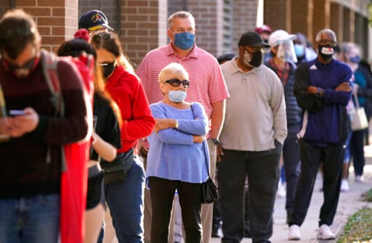 Voters line up outside Richardson City Hall for early voting Tuesday, Oct. 13, 2020, in Richardson, Texas. (AP Photo/LM Otero) Voters line up outside Richardson City Hall for early voting Tuesday, Oct. 13, 2020, in Richardson, Texas. (AP Photo/LM Otero)
