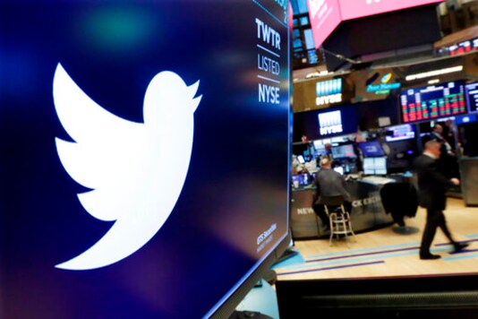 FILE - In this Feb. 8, 2018, file photo, the logo for Twitter is displayed above a trading post on the floor of the New York Stock Exchange. Twitter is imposing new rules, Friday, Oct. 9, 2020, ahead of the U.S. presidential election, prohibiting people, including candidates, from claiming an election win before it is called by either state election officials or two authoritative, national news outlets. (AP Photo/Richard Drew, File) FILE - In this Feb. 8, 2018, file photo, the logo for Twitter is displayed above a trading post on the floor of the New York Stock Exchange. Twitter is imposing new rules, Friday, Oct. 9, 2020, ahead of the U.S. presidential election, prohibiting people, including candidates, from claiming an election win before it is called by either state election officials or two authoritative, national news outlets. (AP Photo/Richard Drew, File)