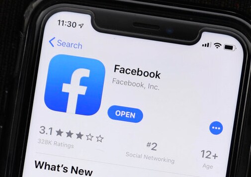 FILE - This July 30, 2019 file photo shows an update information of Facebook application on a mobile phone displayed at a store in Chicago. Facebook, Wednesday, Sept. 30, 2020, says its banning any ads that seek to question the validity of an election, including those claiming widespread voter fraud, in its latest move to crack down ahead of the U.S. presidential election. (AP Photo/Amr Alfiky, File) FILE - This July 30, 2019 file photo shows an update information of Facebook application on a mobile phone displayed at a store in Chicago. Facebook, Wednesday, Sept. 30, 2020, says its banning any ads that seek to question the validity of an election, including those claiming widespread voter fraud, in its latest move to crack down ahead of the U.S. presidential election. (AP Photo/Amr Alfiky, File)