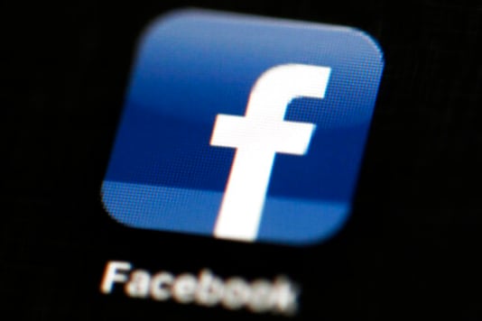 FILE - This May 16, 2012 file photo shows the Facebook app logo on a mobile device in Philadelphia. On Monday, Oct. 12, 2020, Facebook announced it is banning posts that deny or distort the Holocaust and will start directing people to authoritative sources if they search for information about the Nazi genocide. (AP Photo/Matt Rourke, File) FILE - This May 16, 2012 file photo shows the Facebook app logo on a mobile device in Philadelphia. On Monday, Oct. 12, 2020, Facebook announced it is banning posts that deny or distort the Holocaust and will start directing people to authoritative sources if they search for information about the Nazi genocide. (AP Photo/Matt Rourke, File)