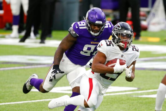 Atlanta Falcons running back Ito Smith (25) runs from Minnesota Vikings defensive end Yannick Ngakoue (91) during the first half of an NFL football game, Sunday, Oct. 18, 2020, in Minneapolis. (AP Photo/Bruce Kluckhohn) Atlanta Falcons running back Ito Smith (25) runs from Minnesota Vikings defensive end Yannick Ngakoue (91) during the first half of an NFL football game, Sunday, Oct. 18, 2020, in Minneapolis. (AP Photo/Bruce Kluckhohn)