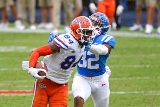 Florida tight end Kyle Pitts (84) breaks away from Mississippi linebacker Jacquez Jones (32) during the second half of an NCAA college football game in Oxford, Miss., Saturday, Sept. 26, 2020. No. 5 Florida won 51-35. (AP Photo/Thomas Graning)