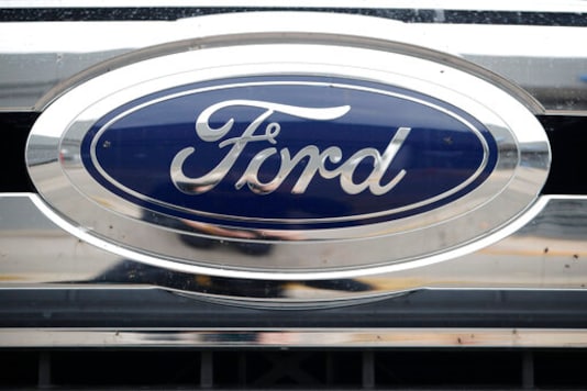 FILE - In this Oct. 20, 2019, file photograph, the company logo shines off the grille of an unsold 2019 F-250 pickup truck at a Ford dealership in Littleton, Colo. Ford Motor Co. posted a stronger-than-expected third-quarter net profit, the company announced Wednesday, Oct. 28, 2020, as demand for cars and trucks recovered from coronavirus shutdowns and the company sold more high-margin trucks. (AP Photo/David Zalubowski, File) FILE - In this Oct. 20, 2019, file photograph, the company logo shines off the grille of an unsold 2019 F-250 pickup truck at a Ford dealership in Littleton, Colo. Ford Motor Co. posted a stronger-than-expected third-quarter net profit, the company announced Wednesday, Oct. 28, 2020, as demand for cars and trucks recovered from coronavirus shutdowns and the company sold more high-margin trucks. (AP Photo/David Zalubowski, File)
