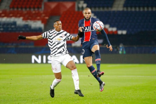 Manchester United's Anthony Martial, left, challenges PSG's Layvin Kurzawa during the Champions League group H soccer match between Paris Saint-Germain and Manchester United at the Parc des Princes in Paris, France, Tuesday, Oct. 20, 2020. (AP Photo/Michel Euler) Manchester United's Anthony Martial, left, challenges PSG's Layvin Kurzawa during the Champions League group H soccer match between Paris Saint-Germain and Manchester United at the Parc des Princes in Paris, France, Tuesday, Oct. 20, 2020. (AP Photo/Michel Euler)