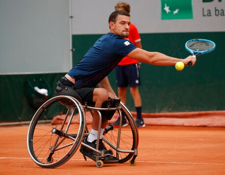 Belgium's Joachim Gerard plays a shot against Japan's Shingo Kunieda in the men's wheelchair semifinal match of the French Open tennis tournament at the Roland Garros stadium in Paris, France, Thursday, Oct. 8, 2020. (AP Photo/Christophe Ena)