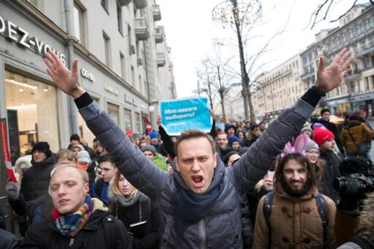 FILE - In this Sunday, Jan. 28, 2018 file photo, Russian opposition leader Alexei Navalny, center, attends a rally in Moscow, Russia. The German government says specialist labs in France and Sweden have confirmed Russian opposition leader Alexei Navalny was poisoned with the Soviet-era nerve agent Novichok. (AP Photo/Evgeny Feldman, File) FILE - In this Sunday, Jan. 28, 2018 file photo, Russian opposition leader Alexei Navalny, center, attends a rally in Moscow, Russia. The German government says specialist labs in France and Sweden have confirmed Russian opposition leader Alexei Navalny was poisoned with the Soviet-era nerve agent Novichok. (AP Photo/Evgeny Feldman, File)