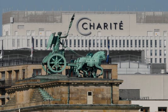 FILE - In this Sept. 14, 2020 file photo, the Quadriga on top of Germany's landmark Brandenburg Gate seen in front of the central Charite building, where Russian opposition leader Alexei Navalny is treated, in Berlin, Germany. The German hospital treating Russian opposition leader Alexei Navalny for poisoning says his condition improved enough for him to be released from the facility. The Charite hospital in Berlin said Wednesday that after 32 days in care, Navalnys condition improved sufficiently for him to be discharged from acute inpatient care. (AP Photo/Markus Schreiber)