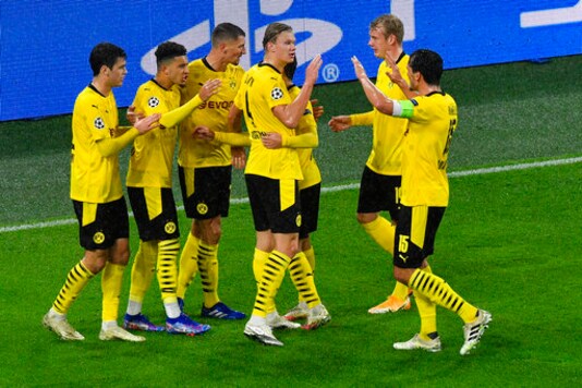 Dortmund's Jadon Sancho, second left, celebrates after scoring his side's opening goal from the penalty spot during the Champions League group F soccer match between Borussia Dortmund and Zenit Saint Petersburg in Dortmund, Germany, Wednesday, Oct. 28, 2020. (AP Photo/Martin Meissner, Pool)