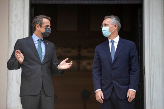 Greek Prime Minister Kyriakos Mitsotakis, left, welcomes NATO Secretary-General Jens Stoltenberg before their meeting in Athens on Tuesday, Oct. 6, 2020. (AP Photo/Petros Giannakouris) Greek Prime Minister Kyriakos Mitsotakis, left, welcomes NATO Secretary-General Jens Stoltenberg before their meeting in Athens on Tuesday, Oct. 6, 2020. (AP Photo/Petros Giannakouris)
