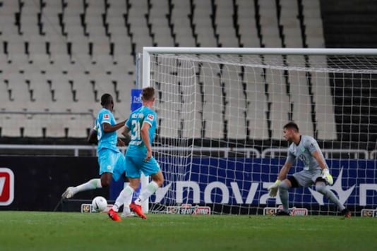 AEK's Karim Ansarifard scores his side's second goal during the Europa League playoff soccer match between AEK Athens and VfL Wolfsburg at the Olympic stadium in Athens, Thursday, Oct. 1, 2020. AEK Athens won 2-1. (AP Photo/Thanassis Stavrakis)