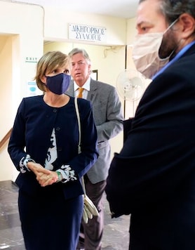 Julie Broaddus Eaton, center, sister of the American scientist Suzanne Eaton, who was raped and killed in Crete last year, stands outside the court room on the first day of the trial in Rethymno, on the Greek island of Crete, Tuesday, Oct. 13, 2020. Yiannis Paraskakis, 27, is accused of the brutal killing of American biologist Suzanne Eaton in 2019. Paraskakis has been charged with the rape and murder of Eaton, 59, who disappeared on July 2, 2019, while attending a conference near Chania and whose body was found six days later in an abandoned underground storage site used during World War II. (AP Photo/Giannis Angelakis) Julie Broaddus Eaton, center, sister of the American scientist Suzanne Eaton, who was raped and killed in Crete last year, stands outside the court room on the first day of the trial in Rethymno, on the Greek island of Crete, Tuesday, Oct. 13, 2020. Yiannis Paraskakis, 27, is accused of the brutal killing of American biologist Suzanne Eaton in 2019. Paraskakis has been charged with the rape and murder of Eaton, 59, who disappeared on July 2, 2019, while attending a conference near Chania and whose body was found six days later in an abandoned underground storage site used during World War II. (AP Photo/Giannis Angelakis)