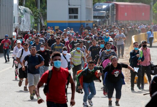 Migrants attempt to cross the border from Corinto, Honduras, into Corinto, Guatemala, Thursday, Oct. 1, 2020. Hundreds of migrants walked from San Pedro Sula, Honduras to the Guatemala border, testing a well-trod migration route now in times of the new coronavirus. (AP Photo) Migrants attempt to cross the border from Corinto, Honduras, into Corinto, Guatemala, Thursday, Oct. 1, 2020. Hundreds of migrants walked from San Pedro Sula, Honduras to the Guatemala border, testing a well-trod migration route now in times of the new coronavirus. (AP Photo)