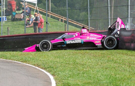 Jack Harvey of England (60) hits the fence during qualifying for the IndyCar Series auto race, at Mid-Ohio Sports Car Course, Sunday, Sept. 13, 2020, in Lexington, Ohio. (AP Photo/Phil Long)