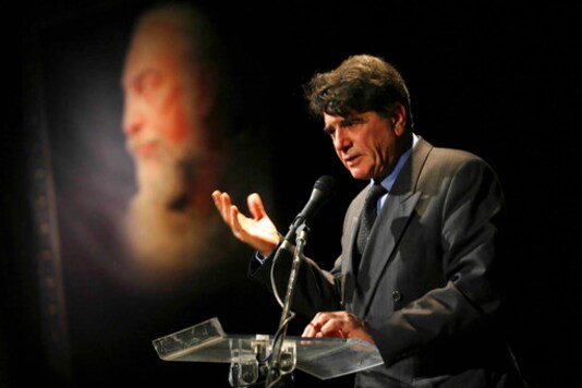 FILE - In this Nov. 11, 2009 file photo, legendary Iranian singer Mohammad Reza Shajarian, delivers a speech, at a ceremony commemorating the late musician Parviz Meshkatian in Tehran, Iran. Shajarian, whose distinctive voice quavered to traditional Persian music on state radio for years before supporting protesters following Irans contested 2009 election, has died, state TV reported Thursday, Oct. 8, 2020. He was 80. (AP Photo/Fars News Agency, Ali Shaigan, File) FILE - In this Nov. 11, 2009 file photo, legendary Iranian singer Mohammad Reza Shajarian, delivers a speech, at a ceremony commemorating the late musician Parviz Meshkatian in Tehran, Iran. Shajarian, whose distinctive voice quavered to traditional Persian music on state radio for years before supporting protesters following Irans contested 2009 election, has died, state TV reported Thursday, Oct. 8, 2020. He was 80. (AP Photo/Fars News Agency, Ali Shaigan, File)