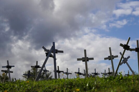 Crosses bearing tags with names are seen in a graveyard of the Flaminio Cemetery, in Rome, Friday, Oct. 16, 2020. Italian prosecutors and the governments privacy watchdog are investigating how the names of women who miscarried or had abortions ended up on crosses over graves for the fetuses in a Rome cemetery. (AP Photo/Gregorio Borgia) Crosses bearing tags with names are seen in a graveyard of the Flaminio Cemetery, in Rome, Friday, Oct. 16, 2020. Italian prosecutors and the governments privacy watchdog are investigating how the names of women who miscarried or had abortions ended up on crosses over graves for the fetuses in a Rome cemetery. (AP Photo/Gregorio Borgia)