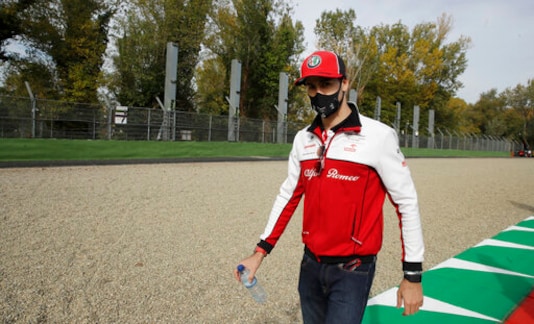 Alfa Romeo driver Antonio Giovinazzi of Italy walks away from the area where Brazilian race car driver Ayrton Senna died, ahead of Sunday's Emilia Romagna Formula One Grand Prix, at the Dino and Enzo Ferrari racetrack, in Imola, Italy, Friday, Oct. 30, 2020. Brazilian Formula One driver Ayrton Senna was killed on May 1, 1994 after his car crashed into a concrete barrier at the Dino and Enzo Ferrari racetrack in Italy. (AP Photo/Luca Bruno)