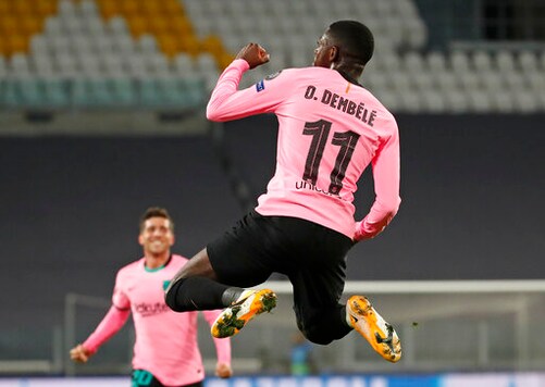 Barcelona's Ousmane Dembele celebrates scoring his side's opening goal during the Champions League group G soccer match between Juventus and Barcelona at the Allianz stadium in Turin, Italy, Wednesday, Oct. 28, 2020. (AP Photo/Antonio Calanni)