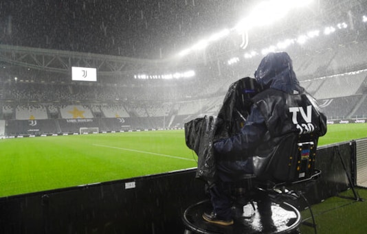 A cameramen films the Allianz Stadium in Turin, Italy, Sunday, Oct. 4, 2020 ahead of the scheduled Serie A soccer match between Juventus and Napoli. Napoli is likely to be handed a 3-0 loss by the Italian leagues judge for failing to show for its Serie A match at Juventus on Sunday night. Napoli did not travel to Turin for the match after local health authorities ordered the squad into quarantine after two players tested positive for the coronavirus. (Tano Pecoraro/LaPresse via AP) A cameramen films the Allianz Stadium in Turin, Italy, Sunday, Oct. 4, 2020 ahead of the scheduled Serie A soccer match between Juventus and Napoli. Napoli is likely to be handed a 3-0 loss by the Italian leagues judge for failing to show for its Serie A match at Juventus on Sunday night. Napoli did not travel to Turin for the match after local health authorities ordered the squad into quarantine after two players tested positive for the coronavirus. (Tano Pecoraro/LaPresse via AP)