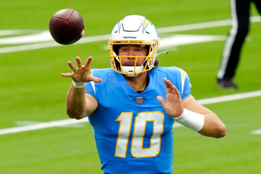 Los Angeles Chargers quarterback Justin Herbert pitches the ball during the first half of an NFL football game against the Jacksonville Jaguars Sunday, Oct. 25, 2020, in Inglewood, Calif. (AP Photo/Alex Gallardo)