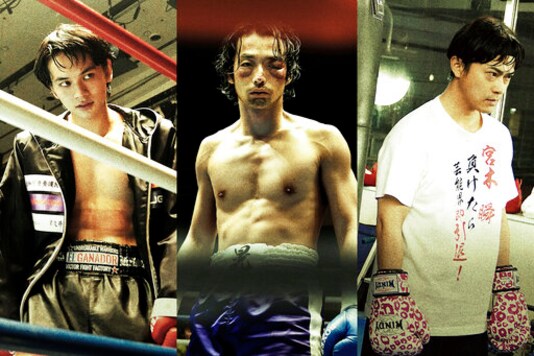 This undated combination image of photos provided by 2020 UNDERDOG FILM PARTNERS shows Takumi Kitamura, from left, Mirai Moriyama and Ryo Katsuji, in the movie sets of Underdog, directed by Masaharu Take. Take's films have always focused on painful stories about Japans 