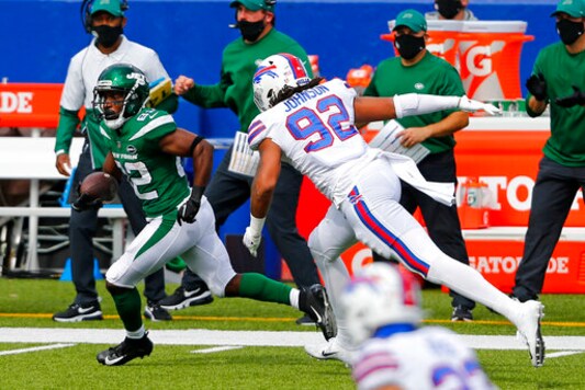 New York Jets wide receiver Jamison Crowder (82) gets past Buffalo Bills defensive end Darryl Johnson (92) after taking a pass from quarterback Sam Darnold and scoring during the second half of an NFL football game in Orchard Park, N.Y., Sunday, Sept. 13, 2020. (AP Photo/Jeffrey T. Barnes)
