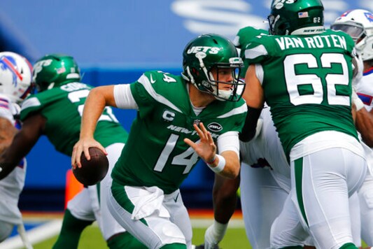 New York Jets quarterback Sam Darnold (14) moves out of the pocket during the first half of an NFL football game against the Buffalo Bills in Orchard Park, N.Y., Sunday, Sept. 13, 2020. (AP Photo/Jeffrey T. Barnes) New York Jets quarterback Sam Darnold (14) moves out of the pocket during the first half of an NFL football game against the Buffalo Bills in Orchard Park, N.Y., Sunday, Sept. 13, 2020. (AP Photo/Jeffrey T. Barnes)