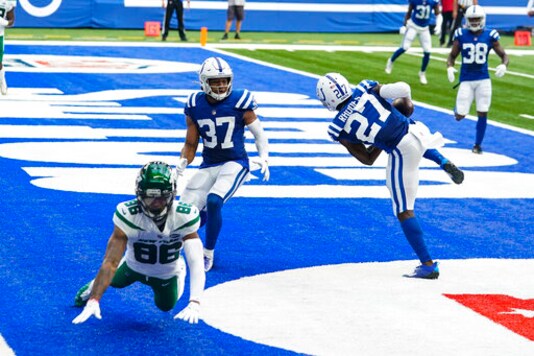 Indianapolis Colts cornerback Xavier Rhodes (27) intercept a pass intended for New York Jets receiver Lawrence Cager (86) in the first half of an NFL football game in Indianapolis, Sunday, Sept. 27, 2020. (AP Photo/Darron Cummings)