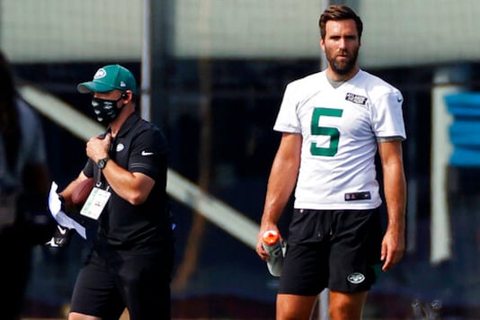 FILE - In this Saturday, Aug. 22, 2020, file photo, New York Jets quarterback Joe Flacco (5) pauses during practice at the NFL football team's training camp in Florham Park, N.J. Flacco is preparing this week to start against the Arizona Cardinals after a sprained shoulder sidelined Sam Darnold for at least a game. (AP Photo/Adam Hunger, File) FILE - In this Saturday, Aug. 22, 2020, file photo, New York Jets quarterback Joe Flacco (5) pauses during practice at the NFL football team's training camp in Florham Park, N.J. Flacco is preparing this week to start against the Arizona Cardinals after a sprained shoulder sidelined Sam Darnold for at least a game. (AP Photo/Adam Hunger, File)