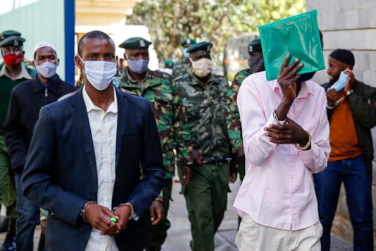 Mohamed Ahmed Abdi, left, who is charged with aiding the gunmen involved in the Westgate Mall attack in Sept. 2013, arrives for the ongoing trial at Milimani court in the capital Nairobi, Kenya Monday, Oct. 5, 2020. The verdict in the ongoing trial was expected on Monday but has been postponed by the judge. (AP Photo/Brian Inganga) Mohamed Ahmed Abdi, left, who is charged with aiding the gunmen involved in the Westgate Mall attack in Sept. 2013, arrives for the ongoing trial at Milimani court in the capital Nairobi, Kenya Monday, Oct. 5, 2020. The verdict in the ongoing trial was expected on Monday but has been postponed by the judge. (AP Photo/Brian Inganga)