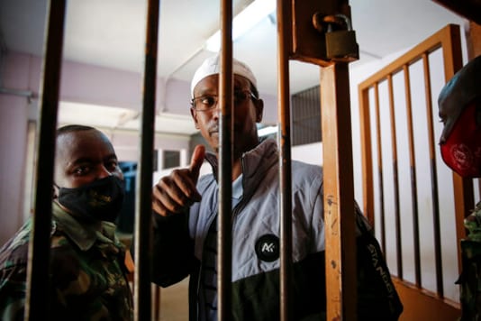 Liban Abdullah Omar, who was found innocent of supporting the gunmen involved in the Westgate Mall attack in Sept. 2013, gestures after the verdict was delivered in the trial at Milimani court in the capital Nairobi, Kenya Wednesday, Oct. 7, 2020. A Kenyan court on Wednesday found two men guilty of supporting the 2013 attack by gunmen with the Somalia-based extremist group al-Shabab on Nairobi's upscale Westgate Mall that left 67 people dead, while Chief Magistrate Francis Andayi acquitted a third suspect. (AP Photo/Brian Inganga) Liban Abdullah Omar, who was found innocent of supporting the gunmen involved in the Westgate Mall attack in Sept. 2013, gestures after the verdict was delivered in the trial at Milimani court in the capital Nairobi, Kenya Wednesday, Oct. 7, 2020. A Kenyan court on Wednesday found two men guilty of supporting the 2013 attack by gunmen with the Somalia-based extremist group al-Shabab on Nairobi's upscale Westgate Mall that left 67 people dead, while Chief Magistrate Francis Andayi acquitted a third suspect. (AP Photo/Brian Inganga)