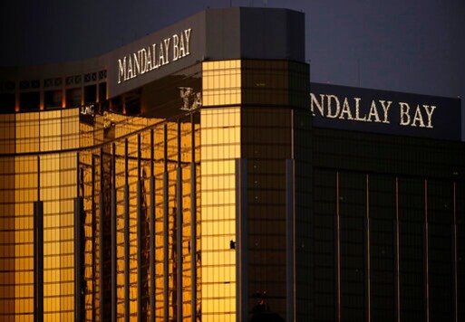 FILE - In this Oct. 3, 2017, file photo, windows are broken at the Mandalay Bay resort and casino in Las Vegas, the room from where Stephen Craig Paddock fired on a nearby music festival, killing 58 and injuring others, on Oct. 1, 2017. A judge in Nevada has approved a total of $800 million in payouts from casino company MGM Resorts International and its insurers to more than 4,400 relatives and victims of the Las Vegas Strip shooting that was the deadliest in recent U.S. history. (AP Photo/John Locher, File)