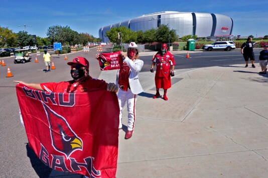 Arizona Cardinals fans cheer outside State Farm Stadium as teams arrive prior to an NFL football game against the Detroit Lions, Sunday, Sept. 27, 2020, in Glendale, Ariz. (AP Photo/Ross D. Franklin) Arizona Cardinals fans cheer outside State Farm Stadium as teams arrive prior to an NFL football game against the Detroit Lions, Sunday, Sept. 27, 2020, in Glendale, Ariz. (AP Photo/Ross D. Franklin)