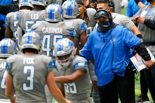 Detroit Lions head coach Matt Patricia greets players after a touchdown against the Atlanta Falcons during the first half of an NFL football game, Sunday, Oct. 25, 2020, in Atlanta. (AP Photo/John Bazemore)