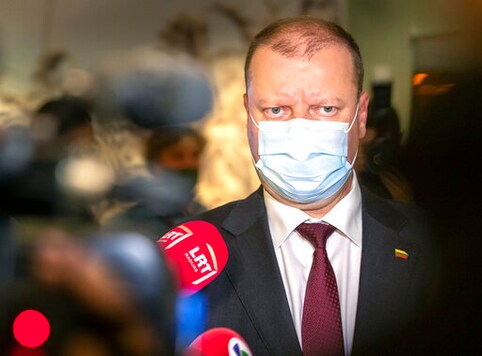 Lithuania's Farmers and Green's Union (LFGU) party leader, Lithuania's Prime Minister Saulius Skvernelis, wearing a face mask to protect against coronavirus speaks to the media as he waits for the results of first round Lithuania's parliamentary elections in Vilnius, Lithuania, Sunday, Oct. 11, 2020. Lithuanians have voted in the first round of the parliamentary election in which the electorate will choose 141 national lawmakers, and the ruling four-party coalition is facing a stiff challenge from the opposition. (AP Photo/Mindaugas Kulbis) Lithuania's Farmers and Green's Union (LFGU) party leader, Lithuania's Prime Minister Saulius Skvernelis, wearing a face mask to protect against coronavirus speaks to the media as he waits for the results of first round Lithuania's parliamentary elections in Vilnius, Lithuania, Sunday, Oct. 11, 2020. Lithuanians have voted in the first round of the parliamentary election in which the electorate will choose 141 national lawmakers, and the ruling four-party coalition is facing a stiff challenge from the opposition. (AP Photo/Mindaugas Kulbis)