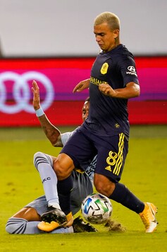 Sporting Kansas City defender Amadou Dia, back, sweeps the ball from Nashville SC midfielder Randall Leal (8) during the first half of an MLS soccer match in Kansas City, Kan., Sunday, Oct. 11, 2020. (AP Photo/Orlin Wagner) Sporting Kansas City defender Amadou Dia, back, sweeps the ball from Nashville SC midfielder Randall Leal (8) during the first half of an MLS soccer match in Kansas City, Kan., Sunday, Oct. 11, 2020. (AP Photo/Orlin Wagner)