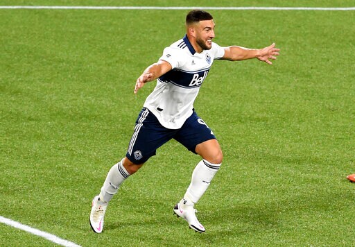 Vancouver Whitecaps forward Lucas Cavallini, celebrates after scoring a goal during the second half of the team's MLS soccer match against the Real Salt Lake in Portland, Ore., Saturday, Oct. 10, 2020. Vancouver won 2-1. (AP Photo/Steve Dykes)
