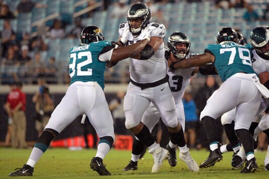 FILE - In this Aug. 15, 2019, file photo, Philadelphia Eagles offensive tackle Jordan Mailata (68) and center Anthony Fabiano (63) block against Jacksonville Jaguars defensive end Lyndon Johnson (92) and defensive tackle Andrew Williams (79) during the second half of an NFL preseason football game in Jacksonville, Fla. The 6-foot-8, 346-pound Mailata has come a long way in a short time and fared well in his first career start protecting Carson Wentz's blind side before a national audience on Sunday Night Football in Philadelphia's 25-20 win at San Francisco, on Oct. 4, 2020.(AP Photo/Phelan M. Ebenhack, FIle)